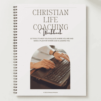 Life Coaching Workbook Cover with title words and woman typing on a computer