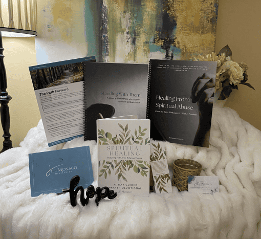 Photo of Care Kit contents includes a book with a leaf image, PDF printouts, and a Jill Monaco Ministries logo card.